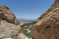 View between two mountains of the blue horizon, the green vegetation.