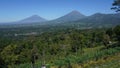 view of two mountains, clear weather during the day, blue sky