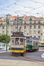 View of two old trams in touristic downtown lisbon, Portugal