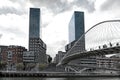 View on two towers Torres de Urbitrate and the pedestrian bridge over the Nervion river in Bilbao, Spain Royalty Free Stock Photo