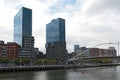 View on two towers Torres de Urbitrate and the pedestrian bridge over the Nervion river in Bilbao, Spain Royalty Free Stock Photo