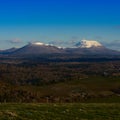 View of the two volcanoes: Puy-de-Dome and Puy-de-Come in snow. Royalty Free Stock Photo