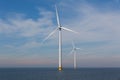 View of two windturbines in the Dutch Noordoostpolder, Flevoland and the IJsselmeer, near the town of Urk.