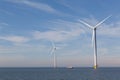 View of two windturbines in the Dutch Noordoostpolder, Flevoland and the IJsselmeer, near the town of Urk.