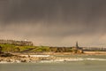 The view of Tynemouth, Cullercoats & Whitley Bay including St Mary`s Lighthouse taken from Tynemouth`s North Pier on a rainy day