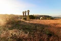 View of typical Alentejo landscape with Portuguese village in morning fog an rising sun at the Rota Vicentina hiking trail near Royalty Free Stock Photo