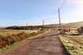 View of typical Alentejo landscape with Portuguese village in morning fog an rising sun at the Rota Vicentina hiking trail near Royalty Free Stock Photo