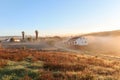 View of typical Alentejo landscape with Portuguese village in morning fog an rising sun at the Rota Vicentina hiking trail near Royalty Free Stock Photo