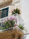 View of typical colorful balcony in a hot day in Polignano a Mar Royalty Free Stock Photo