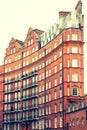 View of typical English building in old red bricks, London Royalty Free Stock Photo