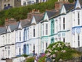 View of typical english row house with bay windows above the harbour of Porthleven