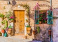 Beautiful mediterranean village house with flower pots plants on wall at Valldemossa, Majorca Spain Royalty Free Stock Photo