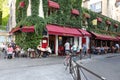 View of typical French cafe Chez Marianne in the quarter Marais, the historic Parisian district set on the Right Bank .