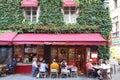 View of typical French cafe Chez Marianne in the quarter Marais, the historic Parisian district set on the Right Bank .