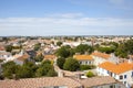 View at typical houses at island of Noirmoutier with red roofs and white walls