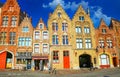 View on typical medieval colorful historical house row with stepped gable roofs against  blue summer sky Royalty Free Stock Photo