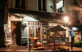 The View of typical paris cafe Le Petit Parisien in Paris, Montmartre area , France.