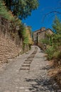 View of typical stone houses with sunny blue sky, in Gordes