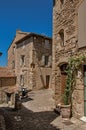 View of typical stone houses with sunny blue sky, in Gordes.