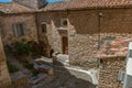 View of typical stone houses with sunny blue sky, in Gordes.