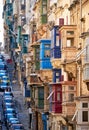 A view of the typical Street of Valletta with traditional maltese balconies.