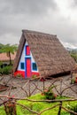 view of typical traditional house in Santana, Madeira, Portugal, Atlantic ocean during rainy day