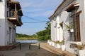 View through typical white one story buildings to the river, Santa Cruz de Mompox, Colombia, World Heritage Royalty Free Stock Photo