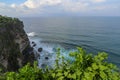 View of Uluwatu cliff with pavilion and blue sea in Bali, Indonesia. Beautiful scenery of Pura Luhur Uluwatu Temple with colorful Royalty Free Stock Photo