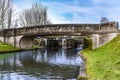 A view under bridge 54 of lock gates at Hatton Locks towards Warwick, UK Royalty Free Stock Photo