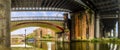 A view under the bridges in the restored Victorian canal system in Castlefield, Manchester, UK Royalty Free Stock Photo