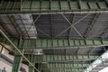 View under high ceiling of open interior space with huge steel truss, columns and beam structure. Royalty Free Stock Photo