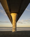 View under New Brighton Pier with massive concrete pillar. Christchurch, New Zealand. Vertical format Royalty Free Stock Photo