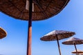 View under thatched beach umbrella, wooden sunshade