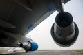 View from under the wing of a large wide-body aircraft on runway airport