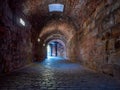 Underground passage under old medieval fortress. Royalty Free Stock Photo