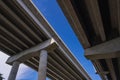 View Underneath a Large Bridge Highway on a Sunny Day with Blue Sky