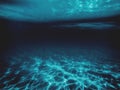 View underwater with sunlight reflection reaching the bottom surface as a background