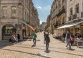 View of unidentified people on a street in Besancon, France