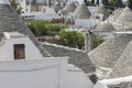 View on the unique limestone roofs of the cone-shaped houses in Alberobello, Apulia, Italy.