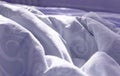 View of an unmade bed in a hotel bedroom with a crumpled sheet, duvet/duvet and pillows after waking up in the morning. Lack of Royalty Free Stock Photo