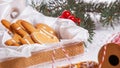 View of the unpacked christmas present with sweets against the background of a spruce branch