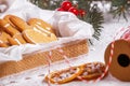 View of the unpacked christmas present with sweets against the background of a spruce branch