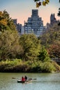 View of couple on a rowboat enjoying a lake in Central Park, New York. Royalty Free Stock Photo