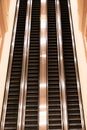 Up and down escalators inside unknown hotel lobby Royalty Free Stock Photo
