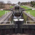 View up the flight of Caen Hill locks from the bottom lock gate on the Kennet and Avon canal, Devizes, Wiltshire