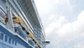 view up to the cruise ship decks against clear blue sky in tropical summer holiday daytime, giant luxuary cruise ship docking