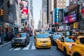 View up a very crowded avenue during rush hour in Manhattan New York City showing heavy traffic and crowds of people Royalty Free Stock Photo