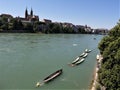 View on the urban river Rhine with moored rowing boats flowing through Basel Royalty Free Stock Photo