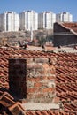 View of Urban Transformation Buildings over an old House Rooftop Royalty Free Stock Photo