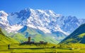 View on Ushguli village at the foot of snow-capped Mt. Shkhara. Royalty Free Stock Photo